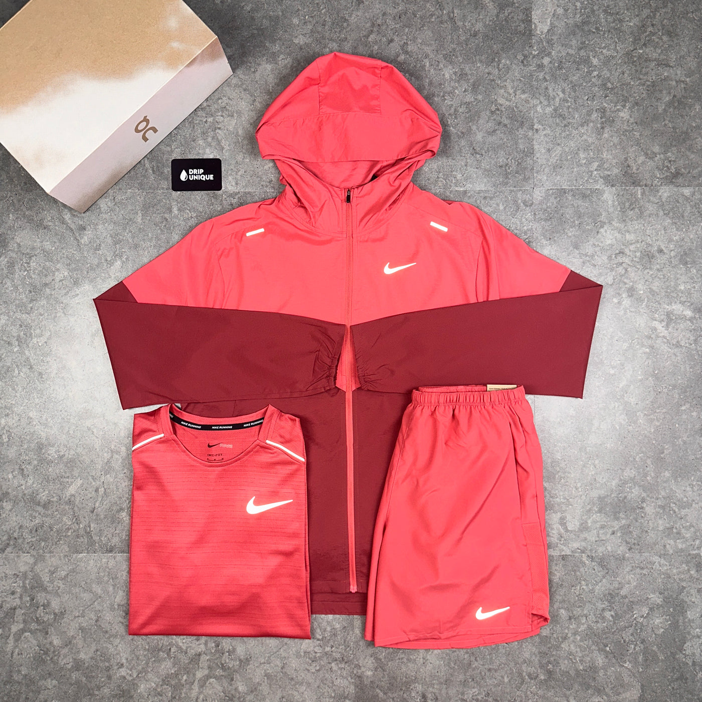 Men's Men's Nike Dri-Fit Challenger Shorts 7" Adobe Red, paired with the nike uv windrunner jacket in adobe red, paired with the adobe red nike miler t-shirt to complete the outfit, dripuniqueuk