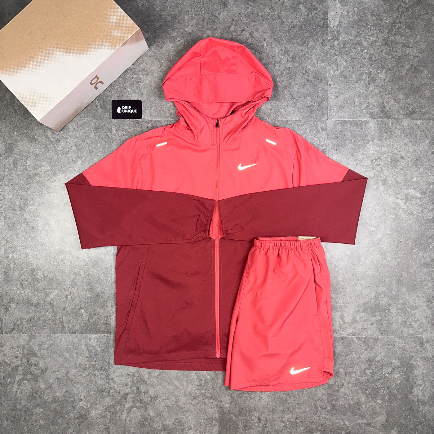 Men's Men's Nike Dri-Fit Challenger Shorts 7" Adobe Red, paired with the nike uv windrunner jacket in adobe red, dripuniqueuk