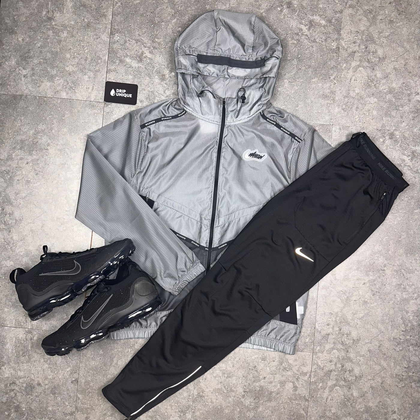 Nike Wildrun Windrunner Jacket in a black colourway Black combined with the Nike Phenom Pants Black, and the Black Nike Vapormax Trainers, dripuniqueuk