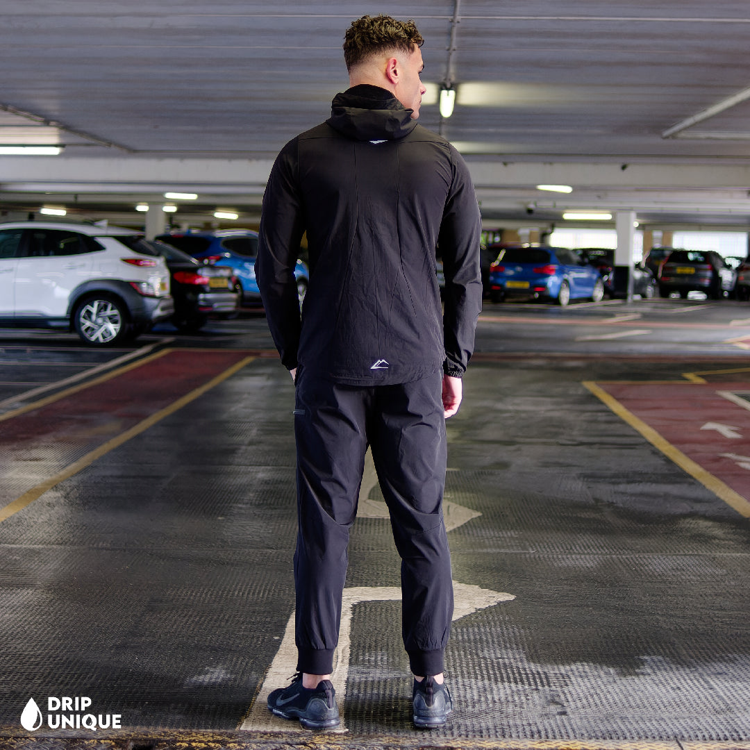 Men's ActiveLine Malay Jacket Blackout, ActiveLine Clothing, showcasing the ActiveLine Malay Jacket in the Blackout colourway, combined with the black onyx activeline pants to complete the look, worn by our model, dripuniqueuk