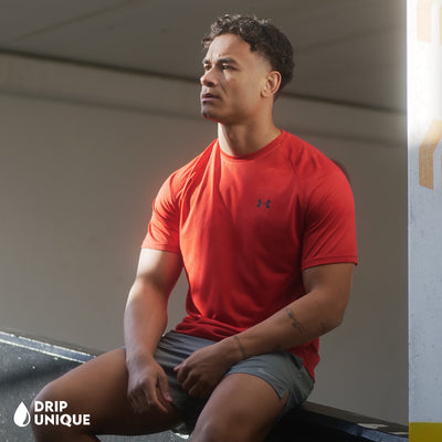 Men's Under Armour Jacquard T-Shirt in Red, being modeled, showing the front design, dripuniqueuk