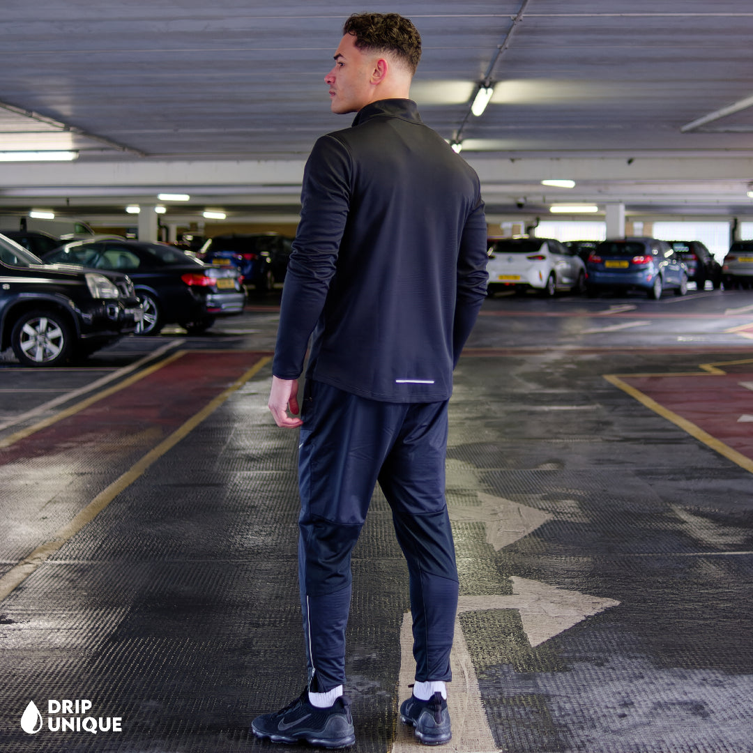 Men's Nike Pacer 1/4 Zip Black & Black Phenom Pants Set, worn by our model, showcasing the Nike Pacer 1/4 Zip Black & Black Phenom Pants Set, dripuniqueuk