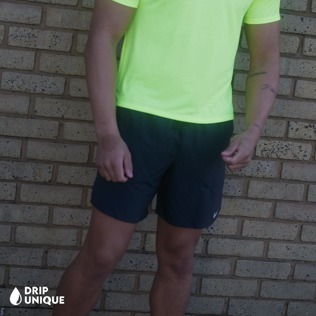 Men's Nike Flex Stride Shorts 7" in Black, showing the front design, paired with the Neon Green Nike Miler 2.0 T-shirt, dripuniqueuk