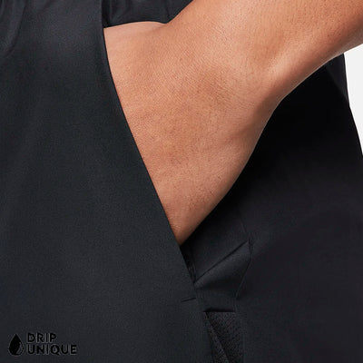 Men's Nike Dri Fit Challenger Shorts 7" in Black, showing the front design being worn by a model, close up, dripuniqueuk