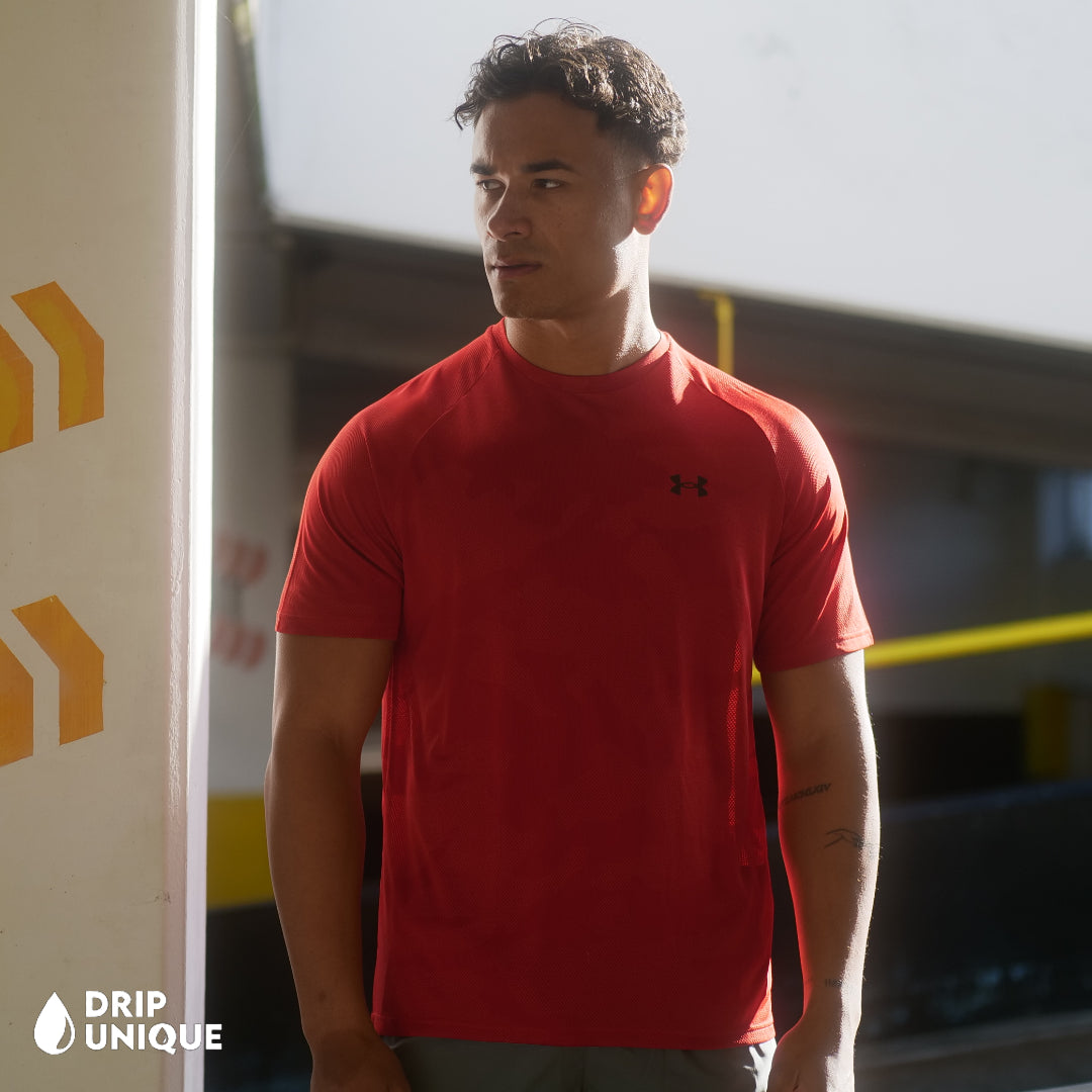 Men's Under Armour Jacquard T-Shirt in Red, being modeled, showing the front design, dripuniqueuk