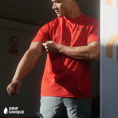 Men's Under Armour Jacquard T-Shirt in Red, being modeled, showing the front design, dripuniqueuk