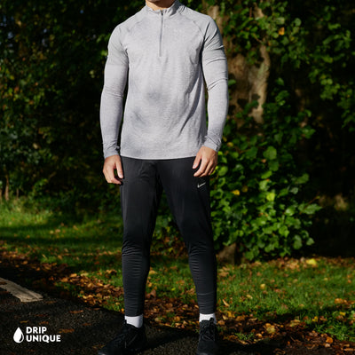 Men's Nike Elite Dri-Fit Phenom Pants in Black, showing the front design, paired with the grey nike element 1/4 zip, dripuniqueuk