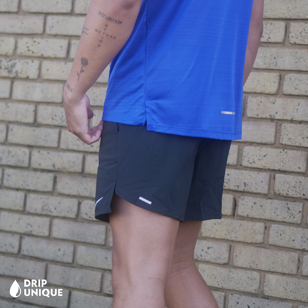 Men's Nike Flex Stride Shorts 7" in Black, showing the side design, paired with the Royal Blue Nike Miler 1.0 T-shirt, dripuniqueuk